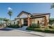 Exterior view of the single-story clubhouse featuring a palm tree at 3021 Countryside Blvd # 26A, Clearwater, FL 33761