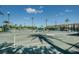 View of the community tennis courts on a sunny day at 3021 Countryside Blvd # 26A, Clearwater, FL 33761