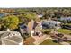 Elegant home featuring a screened-in pool and lush landscaping, nestled within a vibrant community at 3114 Bluff Blvd, Holiday, FL 34691