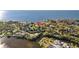 Picturesque aerial view of waterfront homes nestled amidst trees and waterways under a clear sky at 3114 Bluff Blvd, Holiday, FL 34691