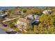 Spacious home with a charming balcony surrounded by green trees in a serene residential area at 3114 Bluff Blvd, Holiday, FL 34691