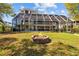 The backyard features a fire pit and a screened-in pool area at 3114 Bluff Blvd, Holiday, FL 34691