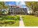 This backyard features a pathway leading to a pool and plenty of green space at 3114 Bluff Blvd, Holiday, FL 34691