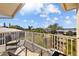 Balcony with seating and railing, offering scenic neighborhood and sky views at 3114 Bluff Blvd, Holiday, FL 34691