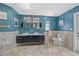 Large bathroom with double sinks, glass block accents, and neutral-toned tile flooring at 3114 Bluff Blvd, Holiday, FL 34691