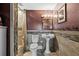 Well-lit bathroom with a pedestal sink, tiled shower, and modern fixtures at 3114 Bluff Blvd, Holiday, FL 34691