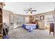 Bright bedroom boasts a large bay window, a ceiling fan, and neutral paint at 3114 Bluff Blvd, Holiday, FL 34691