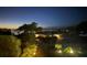 Exterior shot of a beautiful home, illuminated at dusk with a picturesque sky at 3114 Bluff Blvd, Holiday, FL 34691