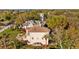 Stately home with a charming balcony and expansive backyard, surrounded by lush greenery at 3114 Bluff Blvd, Holiday, FL 34691