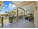 A lovely screened porch overlooks the manicured backyard of this gorgeous property at 3114 Bluff Blvd, Holiday, FL 34691