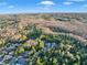 Breathtaking aerial shot of neighborhood with wooded area, pond, and residences at 3198 Thatcher Ln, Tarpon Springs, FL 34688