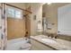 Bathroom featuring shower-tub combo and a granite vanity top at 3198 Thatcher Ln, Tarpon Springs, FL 34688