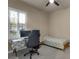 This room features a bed, large window and workstation at 3198 Thatcher Ln, Tarpon Springs, FL 34688