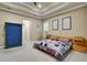Cozy bedroom featuring neutral walls, carpet, a bed with a quilt and plantation shutters at 3198 Thatcher Ln, Tarpon Springs, FL 34688