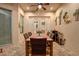 Covered patio with tile flooring, tropical wall decor, and wood dining table with seating at 3198 Thatcher Ln, Tarpon Springs, FL 34688