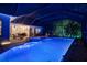 In-ground pool and integrated hot tub with a spacious outdoor patio and lounge area for relaxing and entertaining at 3198 Thatcher Ln, Tarpon Springs, FL 34688