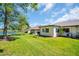 Lush backyard featuring waterfront views and a well-maintained lawn at 3212 Mcmath Dr, Palm Harbor, FL 34684