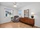 Bright bedroom with natural light, stylish dresser, and a comfortable armchair at 3212 Mcmath Dr, Palm Harbor, FL 34684