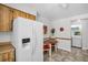 Bright kitchen area features a cozy dining table and modern appliances at 3212 Mcmath Dr, Palm Harbor, FL 34684