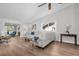 Bright living room featuring modern sofa and beautiful, light, wood-look floors at 3212 Mcmath Dr, Palm Harbor, FL 34684