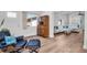 Comfortable living area featuring modern decor, an accent chair, and updated flooring at 3212 Mcmath Dr, Palm Harbor, FL 34684