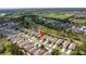 Elevated view showcasing well-maintained homes situated next to a scenic golf course at 3215 Banyan Hill Ln, Land O Lakes, FL 34639