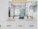 Bright bathroom featuring a dual sink vanity with brass hardware and a tiled shower at 3215 Banyan Hill Ln, Land O Lakes, FL 34639
