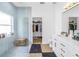 Modern bathroom featuring a glass shower and white vanity with gold accents at 3215 Banyan Hill Ln, Land O Lakes, FL 34639