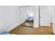 Bedroom with mirrored closet doors showing the chaise lounge and a window at 3215 Banyan Hill Ln, Land O Lakes, FL 34639