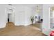 Open foyer with wood-look floors, white walls, and a decorative chandelier at 3215 Banyan Hill Ln, Land O Lakes, FL 34639