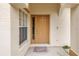 Inviting front entrance with a stylish door, sidelight window, and welcome mat at 3215 Banyan Hill Ln, Land O Lakes, FL 34639
