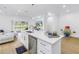 Modern kitchen with an island, stainless steel appliances, and pendant lighting at 3215 Banyan Hill Ln, Land O Lakes, FL 34639