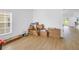View of living room with many moving boxes and hardwood floors at 3215 Banyan Hill Ln, Land O Lakes, FL 34639