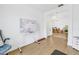 Bright living room with hardwood floors, whiteboard, and view of chandelier lighting at 3215 Banyan Hill Ln, Land O Lakes, FL 34639