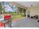 Relax outdoors in the screened patio, ideal for grilling and enjoying peaceful views at 3215 Banyan Hill Ln, Land O Lakes, FL 34639