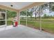 Enjoy outdoor cooking on this screened patio with serene views of lush greenery at 3215 Banyan Hill Ln, Land O Lakes, FL 34639