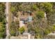Overhead view of a beautiful property surrounded by lush greenery at 35128 Excalibur Rd, Webster, FL 33597