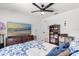 Bedroom featuring carpet, flat screen TV, ceiling fan, and natural lighting at 35128 Excalibur Rd, Webster, FL 33597