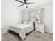 Cozy bedroom with a neutral color scheme, plush carpet and natural light at 35128 Excalibur Rd, Webster, FL 33597