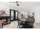 Bright breakfast nook with a view to the lanai, creating a warm, inviting space for casual dining at 35128 Excalibur Rd, Webster, FL 33597
