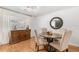 Bright dining area with modern lighting, a round table, and a stylish sideboard for storage and decor at 35128 Excalibur Rd, Webster, FL 33597