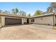 Bright home exterior with solar panels, a two-car garage, and stylish entrance with seating and updated landscaping at 35128 Excalibur Rd, Webster, FL 33597