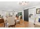 Open floor plan with a modern barn door, visible living and dining areas, creating an inviting, versatile space at 35128 Excalibur Rd, Webster, FL 33597