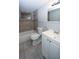 The bathroom is decorated with modern features and tiled walls at 3603 Darlington Rd, Holiday, FL 34691