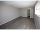 Bedroom features new floors, neutral paint, and a large window at 3603 Darlington Rd, Holiday, FL 34691