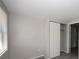 This is an empty bedroom featuring wood-look floors and a closet at 3603 Darlington Rd, Holiday, FL 34691