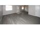 Spacious living room features new floors and neutral colors throughout at 3603 Darlington Rd, Holiday, FL 34691