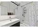 Functional bathroom featuring a combination shower and tub, modern vanity, and ample space for a comfortable experience at 4030 Marlin Se Dr, St Petersburg, FL 33705