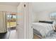 Bright bedroom featuring a plush bed with backyard access and a stylish rug for a cozy and inviting space at 4030 Marlin Se Dr, St Petersburg, FL 33705