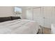 Inviting bedroom features a full bed, with a stylish rug, two storage closets, and soft natural light at 4030 Marlin Se Dr, St Petersburg, FL 33705